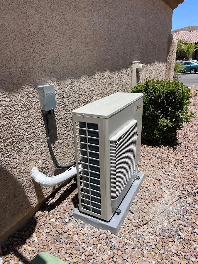 Residential air conditioning condenser unit in Devils Lake